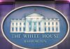 The White House emblem with blue background.