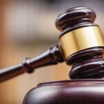 Judge's gavel striking a sound block.