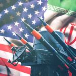 Missiles in front of American and Iranian flags.