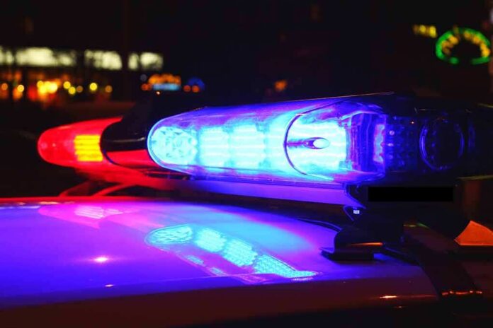 185887181 featured image Police car lights flashing red and blue.