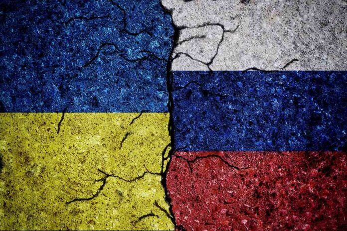2030856296 featured image Cracked Ukrainian and Russian flags painted on concrete.