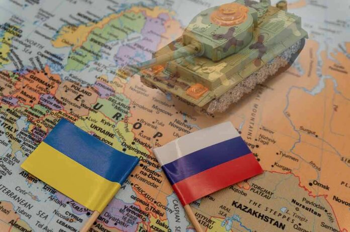 2114384846 featured image Toy tank on map with Ukraine and Russia flags