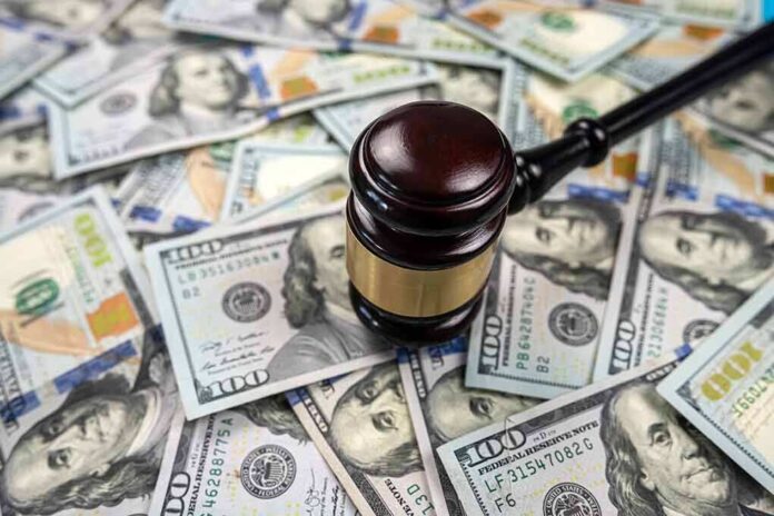 2200663999 featured image Gavel on pile of hundred dollar bills