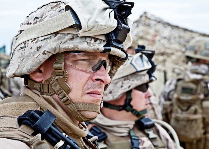 147102638 featured image Soldiers in combat gear looking focused and attentive