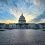 Elon Musk’s Urgent Concerns Over Congressional Finances and Taxpayer Money Use Capitol building under dramatic sky at sunset or sunrise