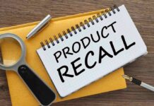 Notebook with product recall text magnifying glass pen