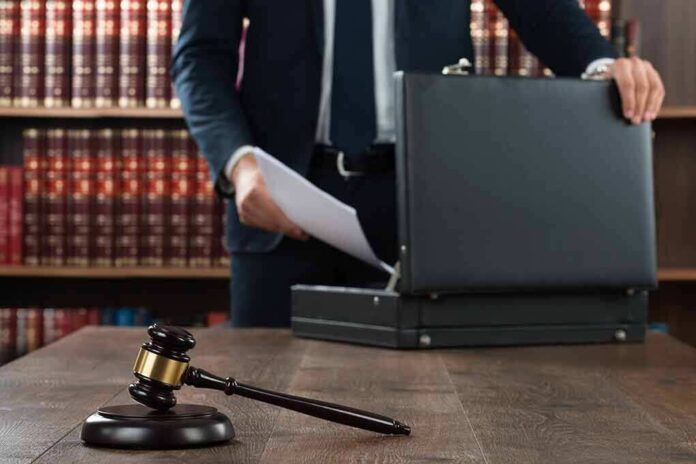 360047027 featured image Gavel and person opening briefcase in law office