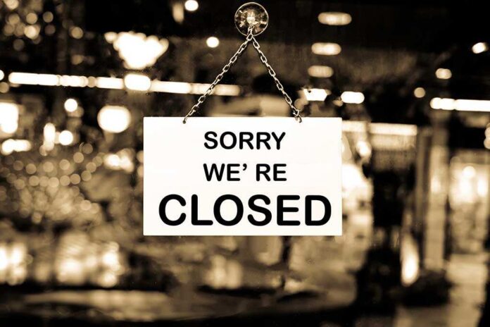 469223957 featured image Closed sign hanging in a shop window.