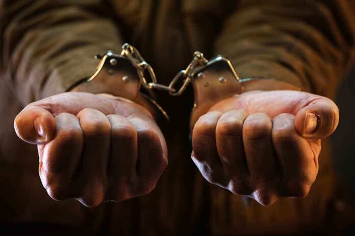 536624479 featured image Hands in handcuffs, close-up view.