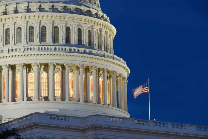 549323791 featured image US Capitol building with American flag illuminated