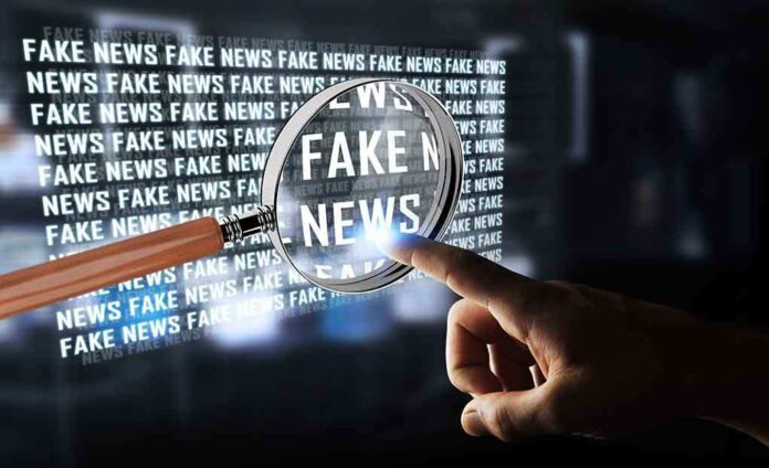 668033083 featured image Magnifying glass highlights fake news text on screen