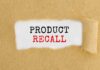 Text Product Recall on torn brown paper.