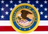 Department of Justice seal on American flag background