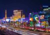 Las Vegas Strip at night with bright neon lights.