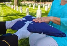 Flag folded and handed over at gravesite ceremony