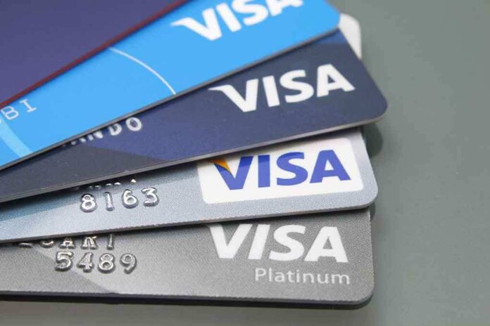 1699083310 featured image Stacked Visa credit cards in various colors.