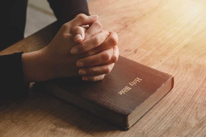 1801756960 featured image Praying hands resting on a Holy Bible