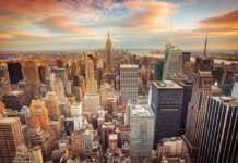 New York City skyline at sunset with tall buildings