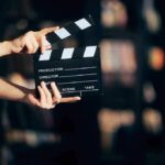 Independent Filmmaker Claims Malia Obama Copied Key Scenes in Film Dispute Hands holding a film clapperboard against a dark background