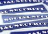 Blue Social Security cards piled together