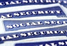 Blue Social Security cards piled together