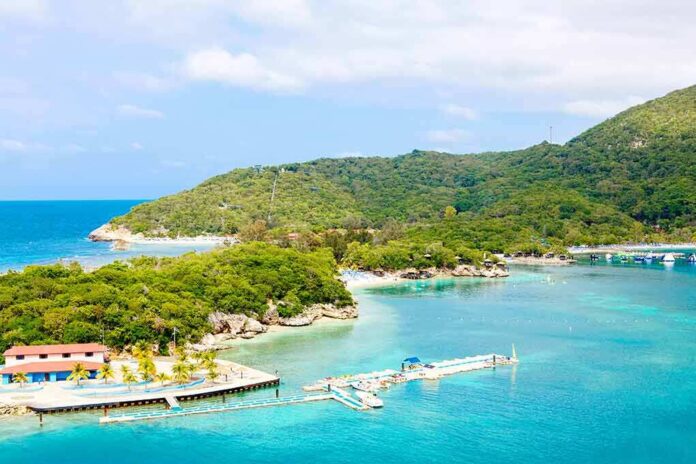 Tropical beach with dockstand lush green hill