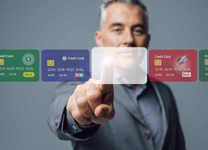 737497186 featured image Man interacting with virtual credit card interface