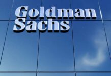 Goldman Sachs sign on glass building facade