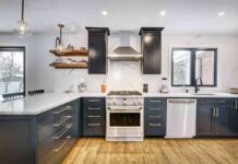 Modern kitchen with black cabinets and marble countertops