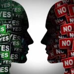 Silhouettes filled with YES and NO signs facing each other