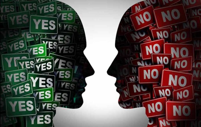 1994812379 featured image Silhouettes filled with YES and NO signs facing each other