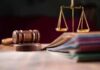 Judges gavel, scales of justice, and legal documents
