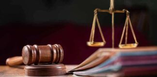 Judges gavel, scales of justice, and legal documents