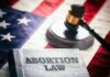 Book titled Abortion Law gavel American flag background