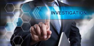 Man in suit pointing at Investigations text