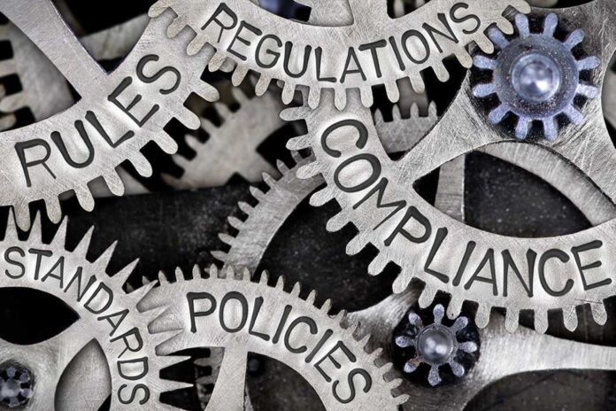 635952077 featured image Gears labeled: rules, regulations, compliance, standards, policies.