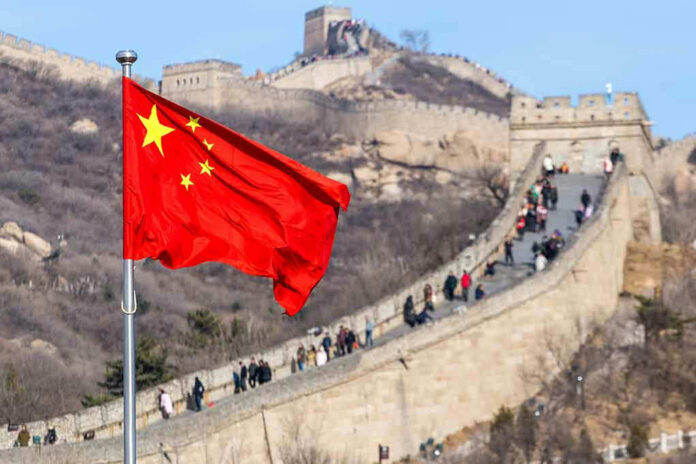 1145455832 Chinese flag by the Great Wall of China