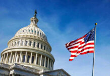 US Capitol building with American flag in foreground