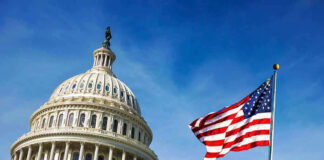 US Capitol building with American flag in foreground