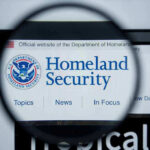 Magnifying glass showing Homeland Security website