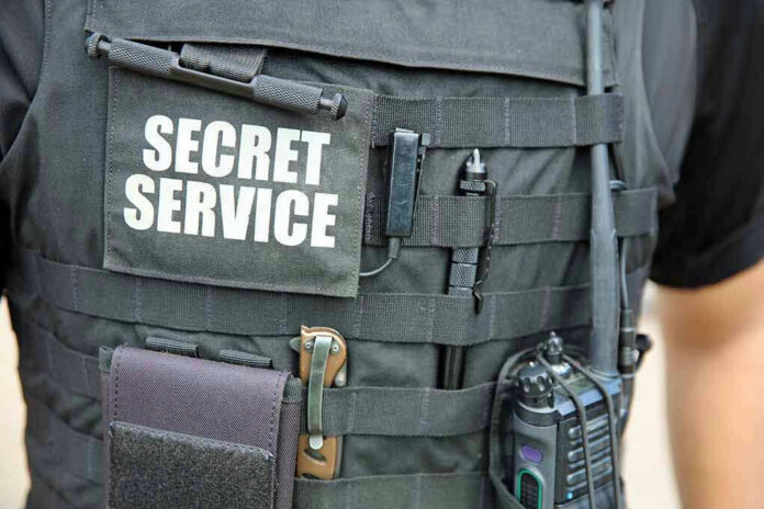 1520321309 Secret Service vest with various tactical gear attached