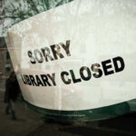 Sorry, library closed sign on window