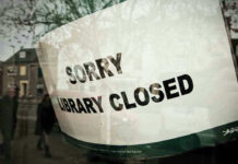 Sorry, library closed sign on window