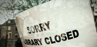 Sorry, library closed sign on window