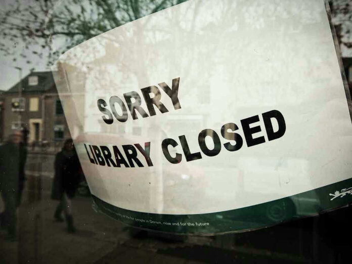 1562470024 Sorry, library closed sign on window