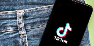 Phone with TikTok logo in jeans pocket