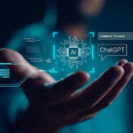 Hand holding digital AI and ChatGPT graphics