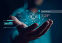 Hand holding digital AI and ChatGPT graphics