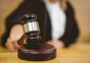 Judge striking gavel in a courtroom