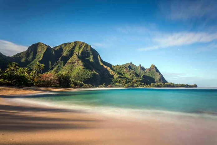 268481546 Beach with mountains and clear blue water